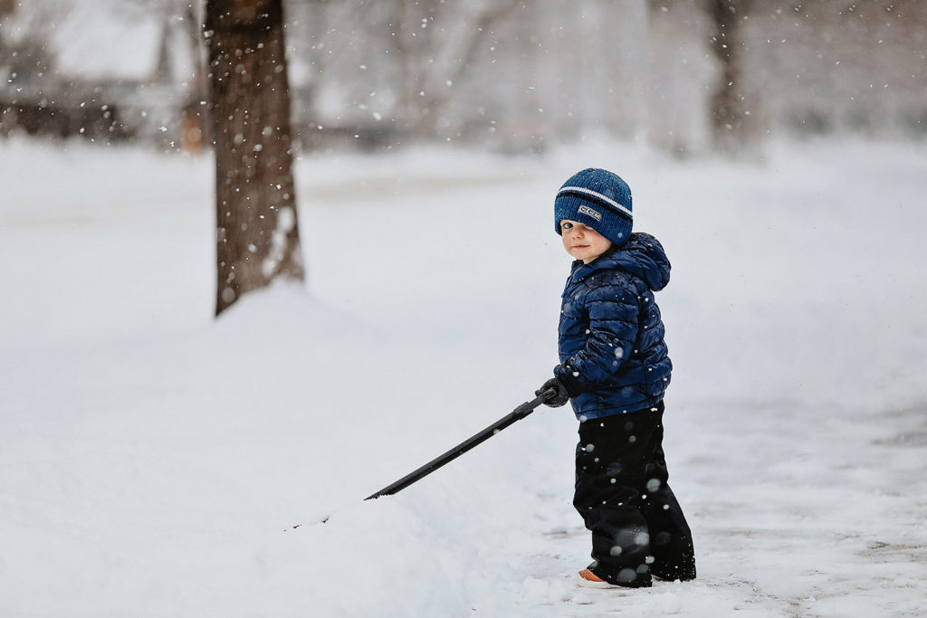 toddler shoveling snow in boise
